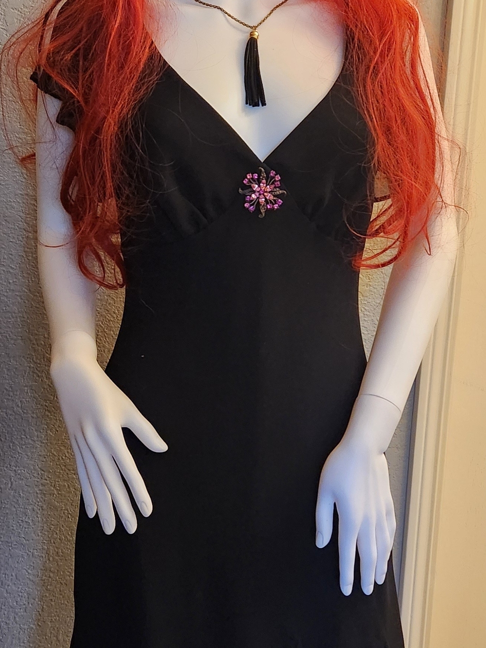 Classic Black V-Neck Slip Dress with Pink Brooch Detail